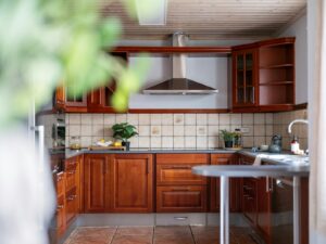 A kitchen with a table a sink and cabinets